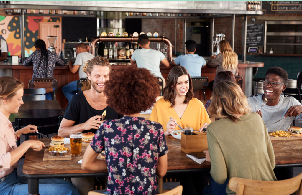 Busy pub garden during peak summer hospitality service