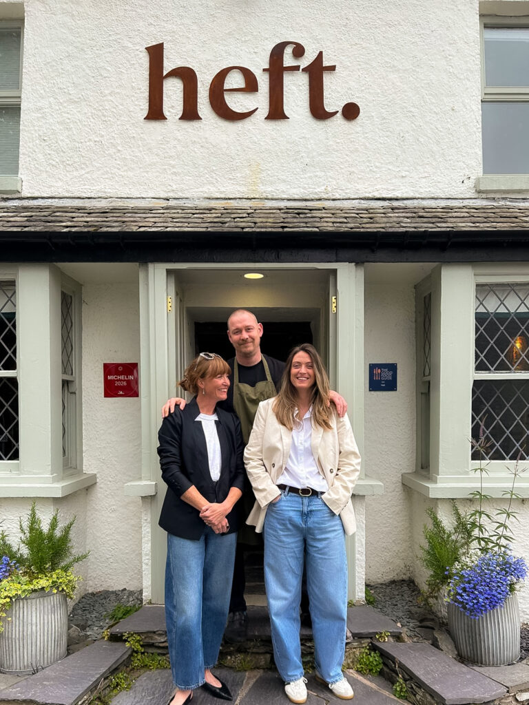 Angela Byrne and Hannah Taylor from Ginger Hospitality with Kevin Tickle outside Heft in High Newton